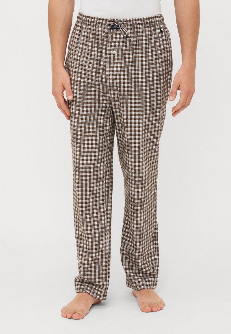 Bruine en witte geruite pyjamabroek met een elastische tailleband en trekkoord. Losse pasvorm, katoenmateriaal en recht gesneden ontwerp.