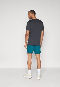 Under Armour VANISH SHORTS - Sportske kratke hlače - dunkelgrün