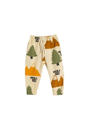 Bomulds joggers med elastisk talje, mønstret med træer og bjerge i grønne, orange og beige nuancer. Har snoretræk og manchetter.