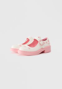 Mary Jane shoes in white with pink accents, featuring floral patterns and a chunky pink heel. Made from a glossy material with a smooth texture.