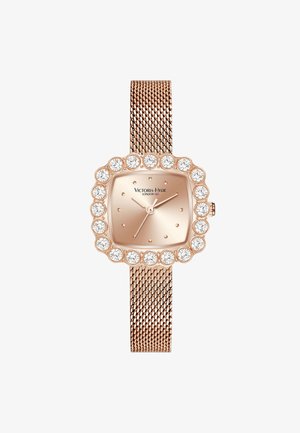 Rose gold mesh strap watch with a square-shaped dial, accented by round crystals around the edge. Minimalist design with hour markers.