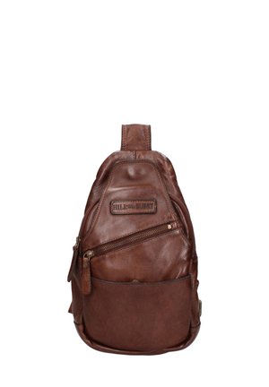 Brown leather backpack with a curved shape, top handle, front zippered pocket, and prominent stitching details. Hardware is bronze-toned.