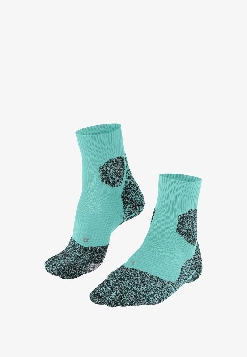 Türkise Knöchelsocken mit einem strukturierten Muster und schwarzen Akzenten, aufrecht vor einem weißen Hintergrund platziert.