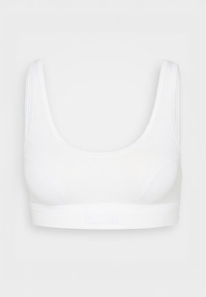 Valge rinnahoidja paksude rihmadega, sileda tekstuuriga ja laia elastse vööga, millel on logo. Lihtne, minimalistlik disain. Ilma traagelniitideta.