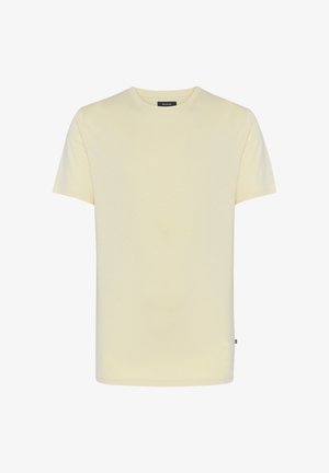 Svetlo rumena majica s kratkimi rokavi iz mehkega, gladkega blaga. Okrogli izrez in raven kroj brez vzorcev ali okrasov.