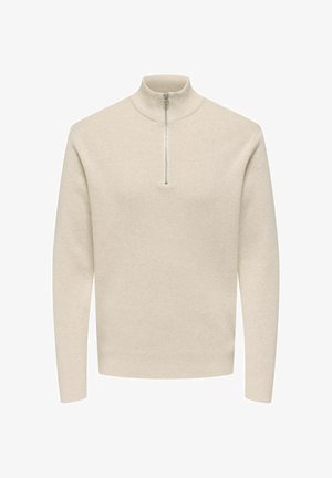 Ljusbeige pullover med hög krage och halvlång dragkedja. Tillverkad av mjukt stickat tyg, med långa ärmar och rak nederkant.