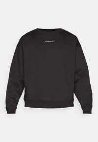 Melnā treniņjakā ar apaļu kaklu, garām piedurknēm un ribotām aprocēm. Virspusē mugurā ir mazs balts logotips. Mīkstais kokvilnas maisījuma materiāls.