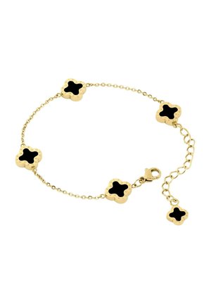 Bracelet chaîne en or avec cinq breloques en forme de trèfle en or, dotées de centres noirs et d'une fermeture à fermoir réglable.