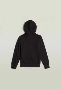 Sudadera con cremallera negra de textura suave, mangas largas y capucha con cordón. Presenta un diseño liso sin logotipos ni patrones visibles.