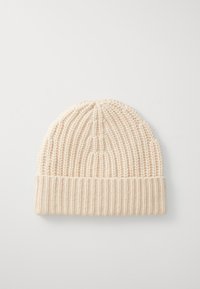 Strickmütze in Hellbeige, mit Rippendesign und umgeschlagenem Bund. Weiche Textur mit nahtlosem Oberteil, ideal für Wärme und Komfort.