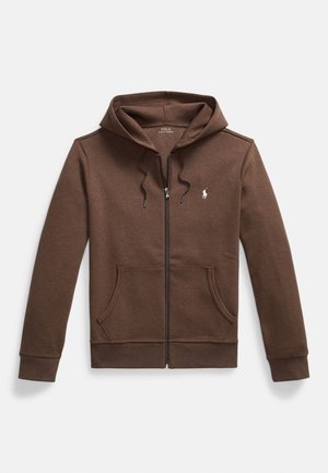 Rudas užsegamas megztinis su gobtuvu, pagamintas iš minkštos medžiagos, su priekyje esančia kario tipo kišene, raišteliu reguliuojamu gobtuvu ir mažyčiu siuvinėtu logotipu ant krūtinės.