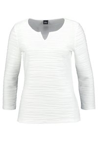 Maglietta bianca a maniche lunghe con scollatura a V, caratterizzata da un motivo a strisce testurizzate. Vestibilità slim con leggero arricciato per un tocco di dettaglio.