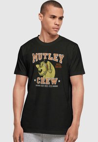 Black cotton t-shirt featuring "MUTLEY CREW" and “WACKY RACES” graphics with a cartoon dog illustration in yellow and orange accents.