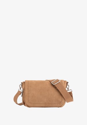 Tan suede crossbody bag with a flap closure, adjustable fabric strap, and silver hardware. Smooth texture and minimalist design.