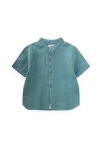 Camicia a maniche corte con bottoni di colore teal, realizzata in tessuto leggero e dalla texture liscia. Presenta un colletto a bande e cinque bottoni in legno.