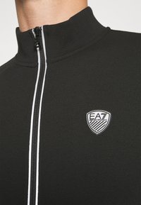 EA7 Emporio Armani Jaka ar rāvējslēdzēju - nero