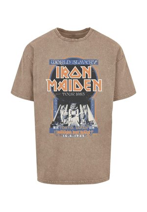 Brown cotton T-shirt featuring a graphic print with "Iron Maiden Tour 1985," pyramids, and text in blue and orange colors.