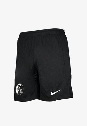 Pantalones cortos deportivos negros con un logo blanco de Nike en la pierna derecha y un emblema en blanco y negro del club de fútbol SC Freiburg en la pierna izquierda.