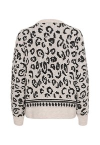 Pull en tricot avec un corps beige et un imprimé léopard noir, accompagné d'un motif décoratif noir le long de l'ourlet. Manches longues avec des poignets côtelés.