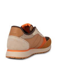 Brown and beige sneaker featuring mixed materials, including suede and mesh, with an orange accent and a cushioned sole.