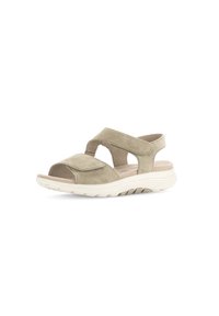 Sandalo in suede beige con punta aperta, cinturini incrociati e suola in gomma bianca imbottita. Presenta ritagli per favorire la circolazione dell'aria e per il comfort.