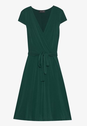 Πράσινο φόρεμα περιτυλίγματος με κοντό μανίκι, V-λαιμό, ζώνη στη μέση και φουσκωτή φούστα. Φτιαγμένο από απαλό, λείο ύφασμα σε ενιαία απόχρωση χωρίς σχέδια.