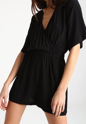 Zwarte romper met een V-hals, korte mouwen en een elastische taille. Gemaakt van lichtgewicht, zachte stof met een relaxed fit.