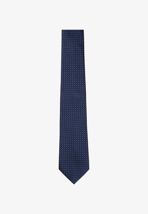 Cravatta blu navy realizzata in tessuto intrecciato, con un motivo testurizzato di piccoli punti bianchi, che si assottiglia verso una punta.