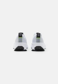 Nike Performance INTERACT RUN - Trail running shoes - white/volt/wolf grey/black