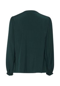 Blusa a maniche lunghe verde scuro con polsini arricciati e scollatura rotonda semplice, mostrata dal retro su uno sfondo bianco.