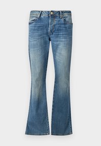 Blauwe flared jeans van denim met een vervaagde was. Beschikken over vijf riemlussen, een knoopsluiting en klassieke stiksels.