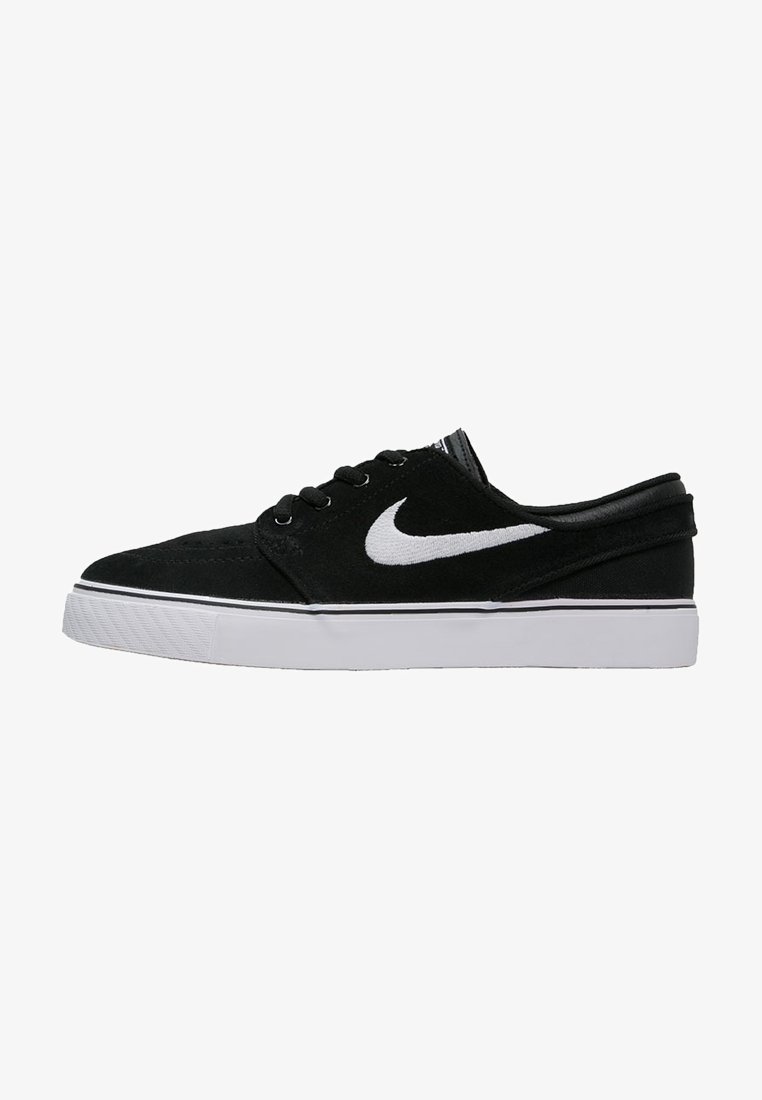 Baskets basses noires avec logo Nike swoosh blanc et semelle blanche, avec lacets noirs et col rembourré.