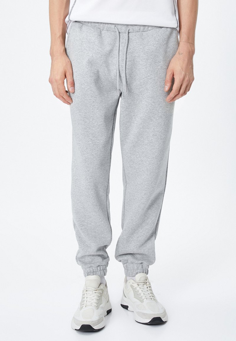 Koton DRAWSTRING POCKET DETAIL Tracksuit bottoms grey Zalando.de