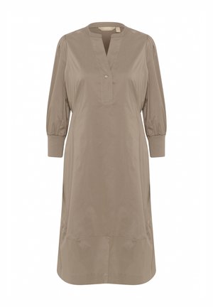 Hellbeiges Kleid mit Mandarin-Kragen, knöpfbarem Ausschnitt, puffärmeligen Ärmeln und lässiger Passform. Hergestellt aus glattem, leichtem Stoff.