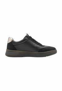 Black sneaker with leather and suede materials, rounded toe, lace-up design, rubber sole, and metallic accent at heel.