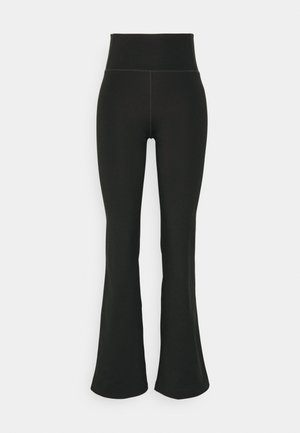 Mustad laiad leggings kõrge vöökohaga, valmistatud elastsetest materjalidest. Sile tekstuur, minimaalsete õmbluse detailidega.