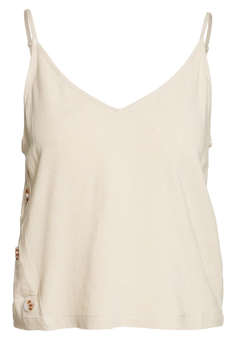 Haut sans manches de couleur crème avec un col en V, en tissu texturé, doté d'accents de boutons sur le côté gauche. Design simple.