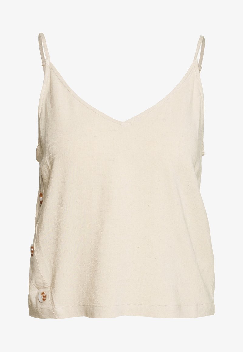 Haut sans manches de couleur crème avec un col en V, en tissu texturé, doté d'accents de boutons sur le côté gauche. Design simple.