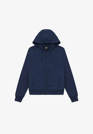 Tengerészkék cipzáros pulóver húzózsinórokkal, elülső zsebekkel, bordázott mandzsettákkal és kis logóval a derékrész közelében, fehér háttéren.