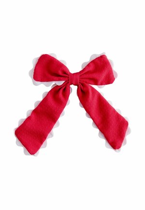 Red fabric bow with two long tails tied in the center, on a plain white background.