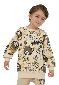 Felpa in cotone beige con grafiche di orsetti dei cartoni animati e testo giocoso. Presenta maniche lunghe e un colletto e polsini a costine.