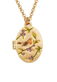 Gold oval locket necklace with enamel design of a bird perched on flowering branches with green leaves and purple blooms.