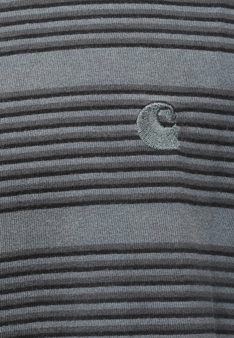 Gray striped sweater made of soft knit material, featuring a subtle embroidered logo in the upper left area and varying stripe thickness.
