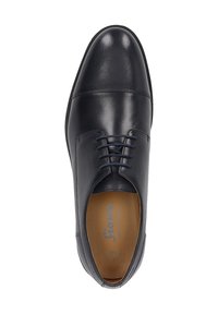 Scarpa elegante in pelle nera con finitura liscia, punta arrotondata e chiusura con lacci. L'interno color nocciola e le cuciture sottili aggiungono un tocco di dettaglio.