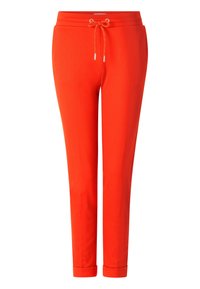 Rote Jogginghose aus weichem Stoff; ausgestattet mit einem elastischen Bund und verstellbarem Kordelzug sowie Bündchen an den Knöcheln.