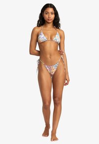 Triangular bikini in a multi-colored floral print. Features adjustable ties on the top and bottom. Made from a smooth fabric.