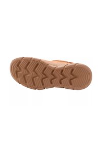 Suola della scarpa in gomma color beige con motivo a zigzag. Testurizzata con sezioni sporgenti per grip. Transizione liscia verso il materiale superiore.