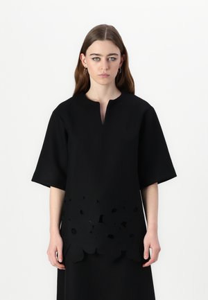 KARMI UNIKKO - Blouse - black
