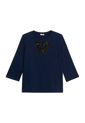 Maglietta a maniche lunghe blu navy con scollatura rotonda, caratterizzata da un grande fiocco decorativo in paillettes nere centrato sul petto.