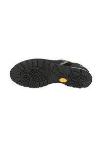 Suola di scarpa in gomma nera con un motivo di battistrada testurizzato, logo Vibram in giallo, con una superficie variabile per presa e trazione.